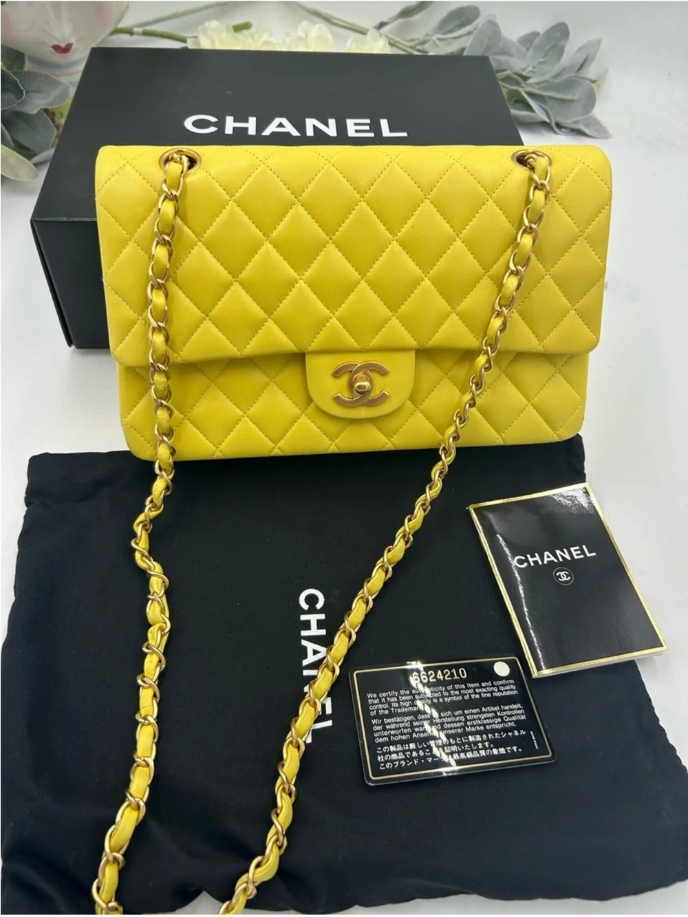 Women’s Chanel, classic quilted double flap bag in yellow with Gould hardware